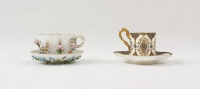 Dresden china cabinet cup and saucer, each lobed, the cup applied and painted numerous floral
