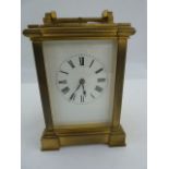 19th century French repeater carriage clock with reeded bar handles, on angular and scroll ends,