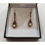 Pair of yellow metal, ruby and diamond drop earrings, each with small rubies and diamonds above
