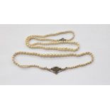 String of graduated cultured pearls on silver and marcasite set clasp and another string of