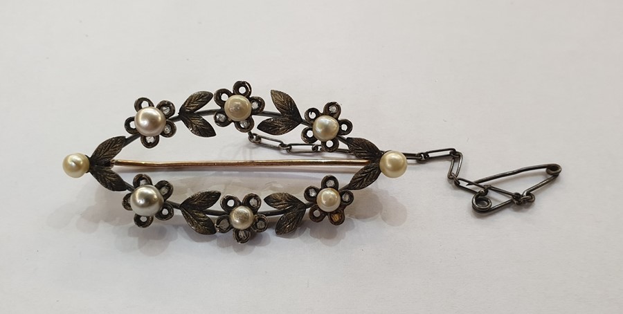 Yellow and white metal, pearl and diamond brooch, pierced elliptical, floral and foliate set with