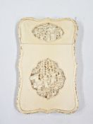 Late 19th/early 20th Chinese carved ivory card case with shaped oval reliefs of figures beside