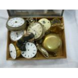 Stainless steel cigarette box containing pocket watches and parts