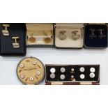 Boxed set of gold-coloured and mother-of-pearl dress studs in a fitted case, another set of