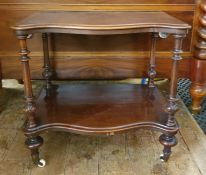 Early Victorian mahogany serpentine-fronted two-tier etagere with moulded edge, the two tiers united