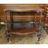 Early Victorian mahogany serpentine-fronted two-tier etagere with moulded edge, the two tiers united