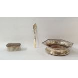 Sterling silver-backed child's hairbrush, a mother-of-pearl handled silver fish knife and a silver-