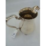 20th century baluster-shaped cream jug with scroll handle, baluster body, on circular foot,