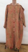 Scottish paisley wool coat with inverted pine and other designs, a deep collar to the back and the