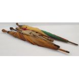 1920's/30's cotton parasol with multicoloured bakelite top on wooden handle, a fabric parasol with