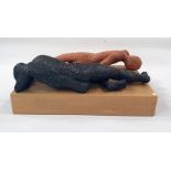 Marlene Badger terracotta sculpture - two reclining gentlemen on wooden base, 42cm long