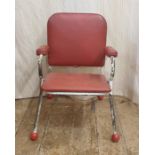 Mid-20th century child's chair with red leatherette seat, back and arms, white painted tubular frame