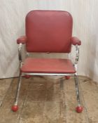 Mid-20th century child's chair with red leatherette seat, back and arms, white painted tubular frame