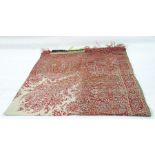 Large 20th century Paisley shawl in pinks, reds and rusts with a central cream design, 173cm x 162cm