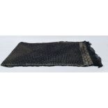 Early 20th century black Assuit shawl on a black mesh ground with hammered gold-coloured