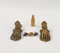 Two Victorian style brass paper clips modelled as hands, a set of dice in turned wood bottle