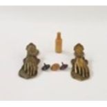 Two Victorian style brass paper clips modelled as hands, a set of dice in turned wood bottle