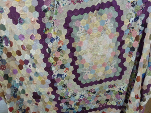 Mid twentieth century patchwork quilt, back with mauve satin, 249 x 237 cms approx. some patches