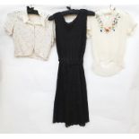 Black shift dress with black beaded lace over flesh coloured net with a belt, a vintage cream