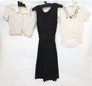 Black shift dress with black beaded lace over flesh coloured net with a belt, a vintage cream