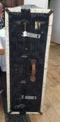 Black and cream painted cabin trunk with fitted interior of shelves and having luggage labels to