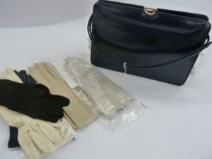 Ackery navy leather handbag, two pairs Cornelia James lady's gloves, pair of lady's cream leather