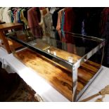 1970's Merrow Associates glass, chrome and rosewood two-tier rectangular coffee table upon