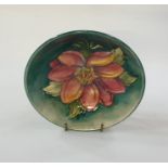 Moorcroft pottery dish, pink clematis decorated on mottled turquoise ground, 16cm diameter (with