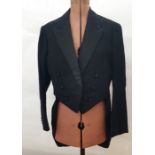 Large quantity of gentleman's tail coats and dinner jackets and various black fabric buttons on