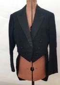 Large quantity of gentleman's tail coats and dinner jackets and various black fabric buttons on