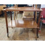 Mid-20th century teak two tier tea trolley, the half gallery tray top above uniting the under-tier