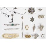 Quantity of marcasite set brooches, silver bar brooch, diamante and other items in leather-covered