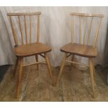 Set of four mid-20th century light elm Ercol seated and beech stick-back and framed dining chairs