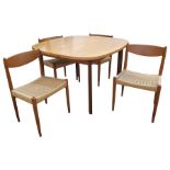 Mid-20th century G-Plan teak and stained wood extending dining table with rounded rectangular top on