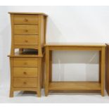 Pair of 20th century oak bedside chests of three drawers and a two-tier hall table (3)