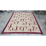 Modern cream ground rug with maroon decoration, 30