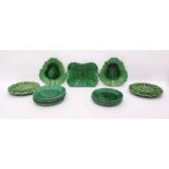 Quantity of green glazed leaf moulded majolica pla