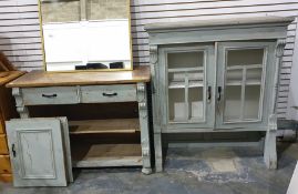 Pine and painted dresser with ogee moulded pediment above the doors enclosing shelves, a base of two