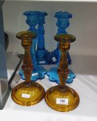 Pair of turquoise pressed glass table candlesticks with petal bases, another pair with lemon