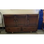 Dark elm Ercol sideboard, three cupboard doors above two drawers, 129cm x 76cm