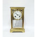 Brass and glass mantel clock with Arabic numerals