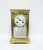 Brass and glass mantel clock with Arabic numerals