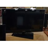 Samsung flatscreen television, 31" with remote control