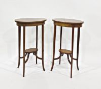 Pair of 19th century mahogany oval plant stands with satinwood and barber shop pole inlay, on four