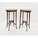 Pair of 19th century mahogany oval plant stands with satinwood and barber shop pole inlay, on four