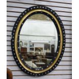Black ebonised, gilt and cut glass button applied oval wall mirrorCondition ReportThe dimensions are
