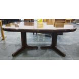 20th century extending dining table on twin pedestal supports