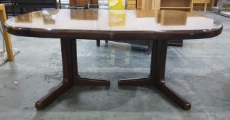 20th century extending dining table on twin pedestal supports