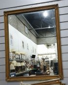 Rectangular wall mirror in gilt-effect frame