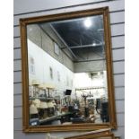 Rectangular wall mirror in gilt-effect frame